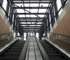 Two underground stairs escalators to the car parking on the roof of the business center 

