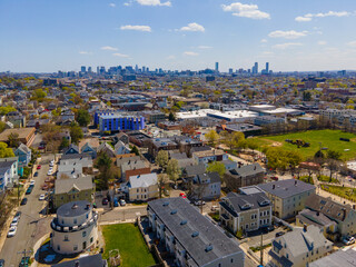Somerville city center aerial view on Somerville Avenue with Boston skyline at the background in...