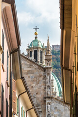 View of the bell tower of Como Cathedral in the historic center of Como city, Lombardy, Italy