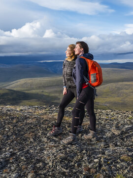 Two women exploring the mountains and wilderness of the Yukon. Feeling alive and vibrant in the beautiful scenery around Haines Junction; Yukon, Canada