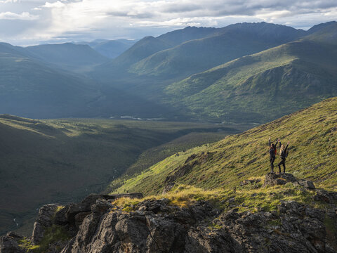 Two women exploring the mountains and wilderness of the Yukon. Feeling alive and vibrant in the beautiful scenery around Haines Junction; Yukon, Canada