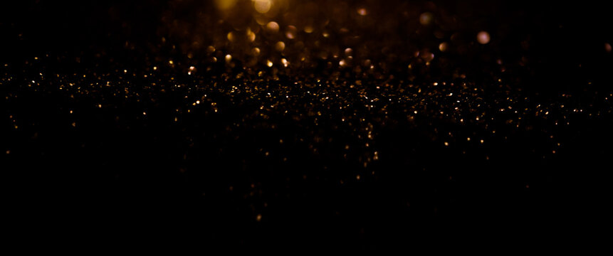 Festive black and gold glitter texture background. New Year and Christmas concept. celebrate background for decoration