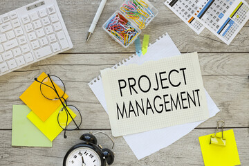 project management bright paper clips and notepad work desk top view