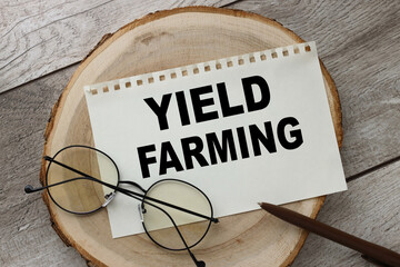 YIELD FARMING. words written on a piece of paper.