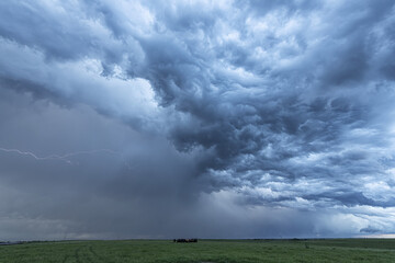 Amazing clouds over the landscape of the American mid-west as supercell thunderstorms develop. Lightning captured on film; Nebraska, United States of America