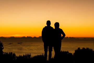 silhouette of a couple at the sunrise