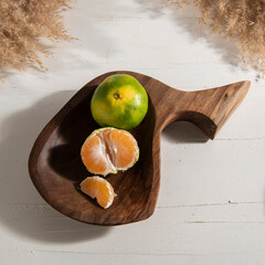 handmade wooden boards with fruits on table