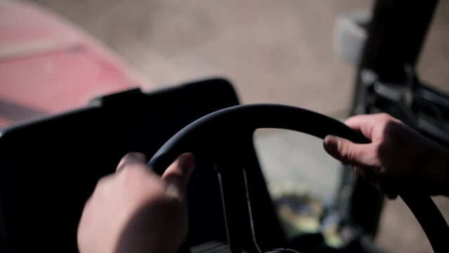 Inside view of a seeder tractor in an agrarian field. Tilling the land in an agricultural field