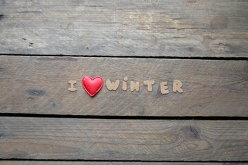 I love winter, inscription on a wooden table.