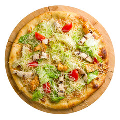 Pizza Caesar with chicken and green salad on wooden board top view isolated on white background