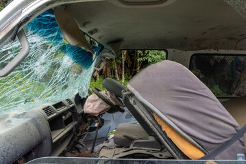 Destructed car after an accident on the road in Te Urewera National Park, New Zealand