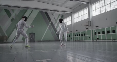 Anonymous women during fencing workout - Powered by Adobe