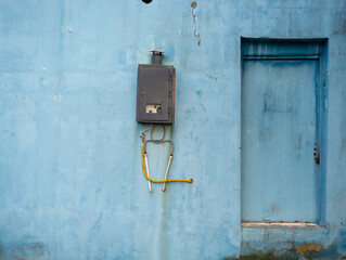 Gas column on the wall. A device for heating water in the south. Household appliance.