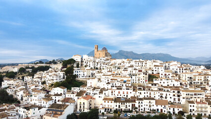 Naklejka premium Aerial image of the town of Altea in Alicante (Spain) with its typical white houses with its church in the center of the image famous for its dome. Mediterranean culture