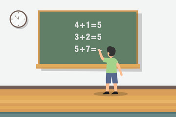 Boy learn math on blackboard in classroom