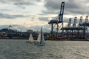 Industry harbor of Auckland and sailboats on the water