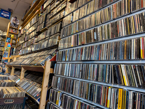 Kirkland, WA USA - circa December 2022: Wide view of used CDs for sale inside a Vortex used cds and vinyl shop.