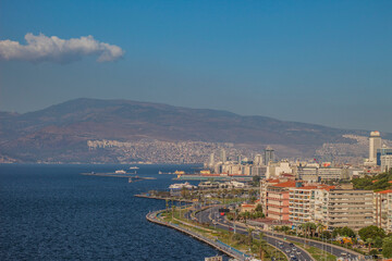 Fototapeta premium Cityscape with sea, sky and sunshine