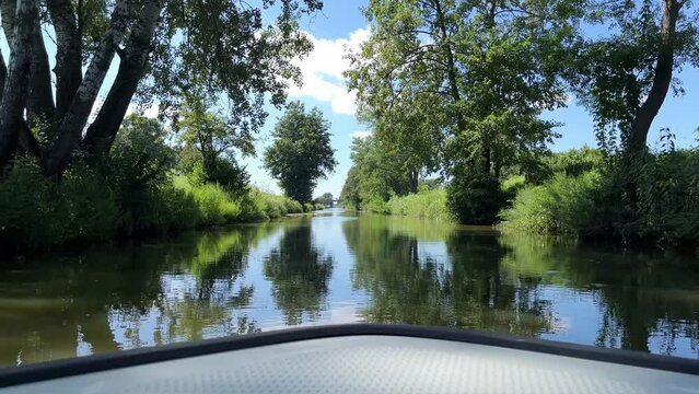 View from a boat floating in a navigable canal.