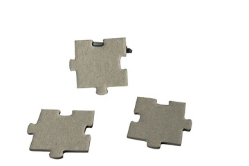 Gray puzzle pieces on a white background. 