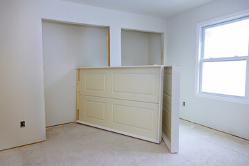 Construction site is process of preparing new residential building for doors to be installed in interior.