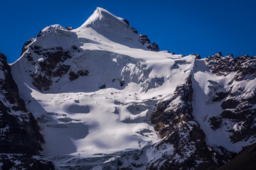 Snowcapped mountain peak with glacier in Cordillera Blanca, Ancash Andes, Peru