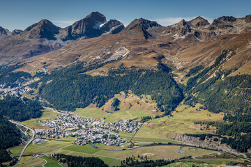 Fototapeta na wymiar Above Celerina cityscape from Muottas Muragl Swiss Alps, Engadine, Switzerland