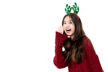 Happy cute Asian girl wear red warm knitted sweater shouting loud Christmas promotion to copy space...