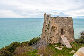 Fototapeta na wymiar Historic Torre di Monte Pucci, a Saracen signal tower at the coast of Gargano, Italy