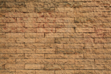 Beautiful stone wall made of bricks as background, closeup