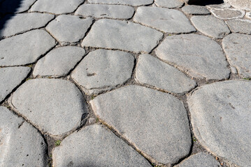 A beautiful typical cobbled street in an ancient Roman city, Italy