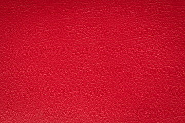 Closeup detail of red leather texture background.
