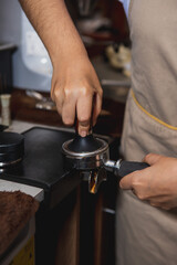 close up of a person preparing a coffee