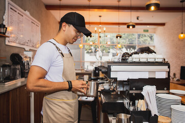 Medium shot of barista making espresso coffee