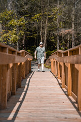 walking in the park over a wooden bridge