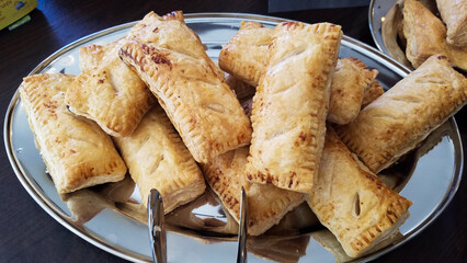Breakfast pastries on a silver platter
