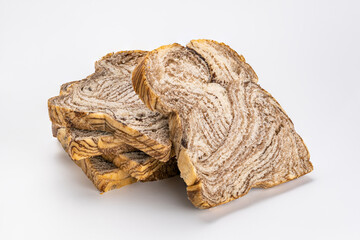 Sliced chocolate danish bread on white background.