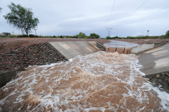 Stormwater runoff flowing in an open channel system after heavy rain in Mesa, Arizona, in 2018
