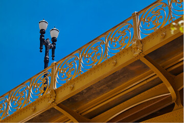 SAO PAULO - DECEMBER 07, 2017: Detail of the side railing design of the famous pedestrian-only Santa Ifigenia Viaduct in downtown Sao Paulo on a sunny day with a lamppost