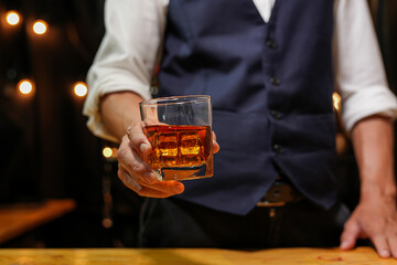 Bartender pouring Whiskey, on  bar,