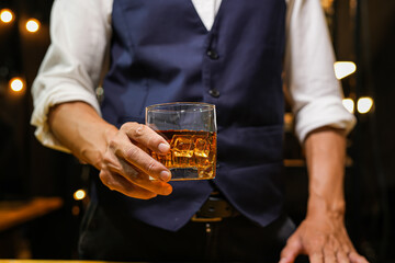 Bartender pouring Whiskey, on  bar,