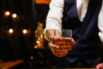 Bartender pouring Whiskey, on  bar