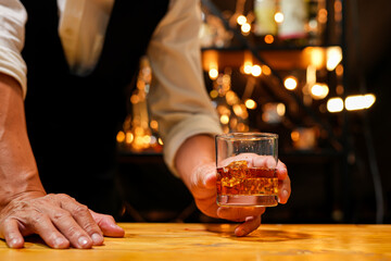 Bartender pouring Whiskey, on  bar,