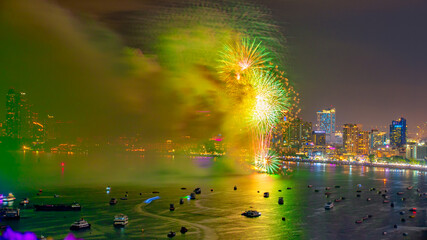The International Fireworks Show of Pattaya, Thailand, displays colorful fireworks in the sea and can be seen from hotels and beaches.