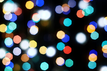 Fototapeta premium multicolored festive lights on a black background screensaver backdrop