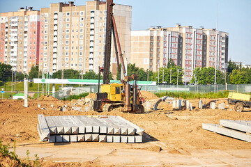 Files are driven into the ground to strengthen the foundation, construction site.