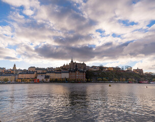 Fototapeta premium View over the district Södermalm a winter day with dark clouds and low sun in Stockholm