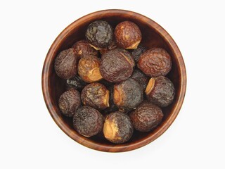 Fototapeta premium Indian soapberry in a bowl on white background 