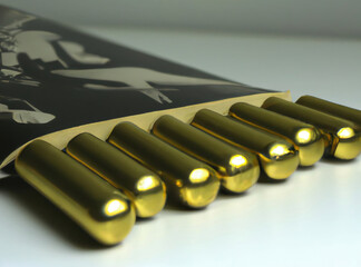 Golden bullets for a revolver on a light background.