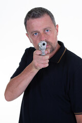 portrait of serious and attractive hitman special agent man holding gun pointing the weapon on white background
